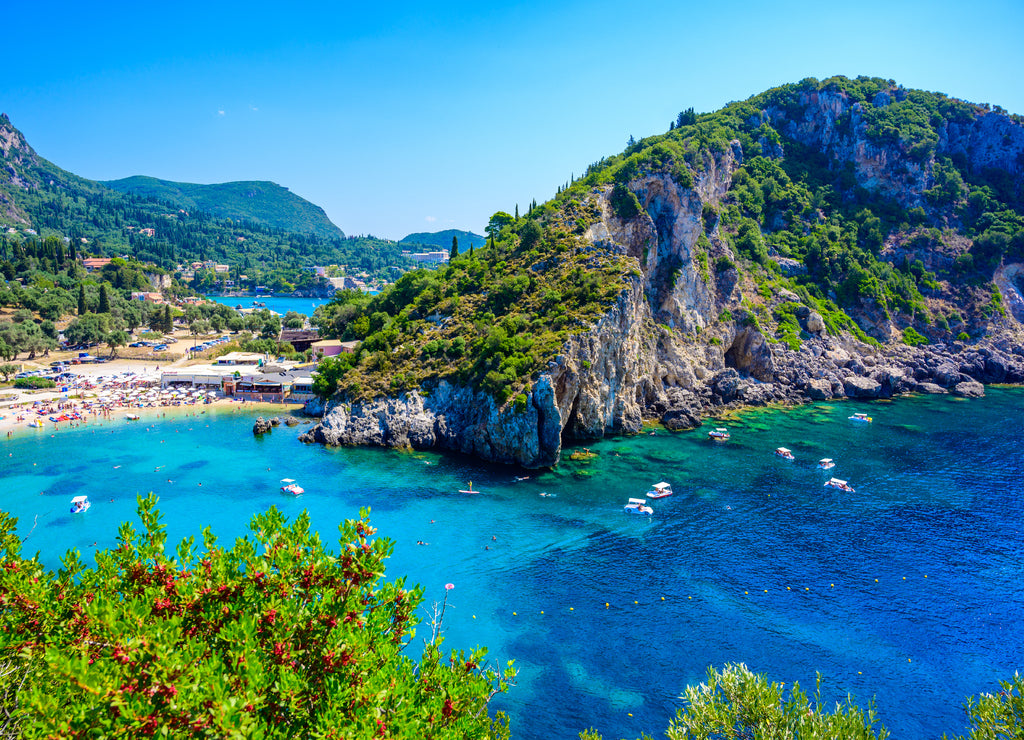 Agios Spiridon Beach with crystal clear azure water and white beach in beautiful landscape scenery - paradise coastline of Corfu island at Paleokastritsa, Ionian archipelago, Greece