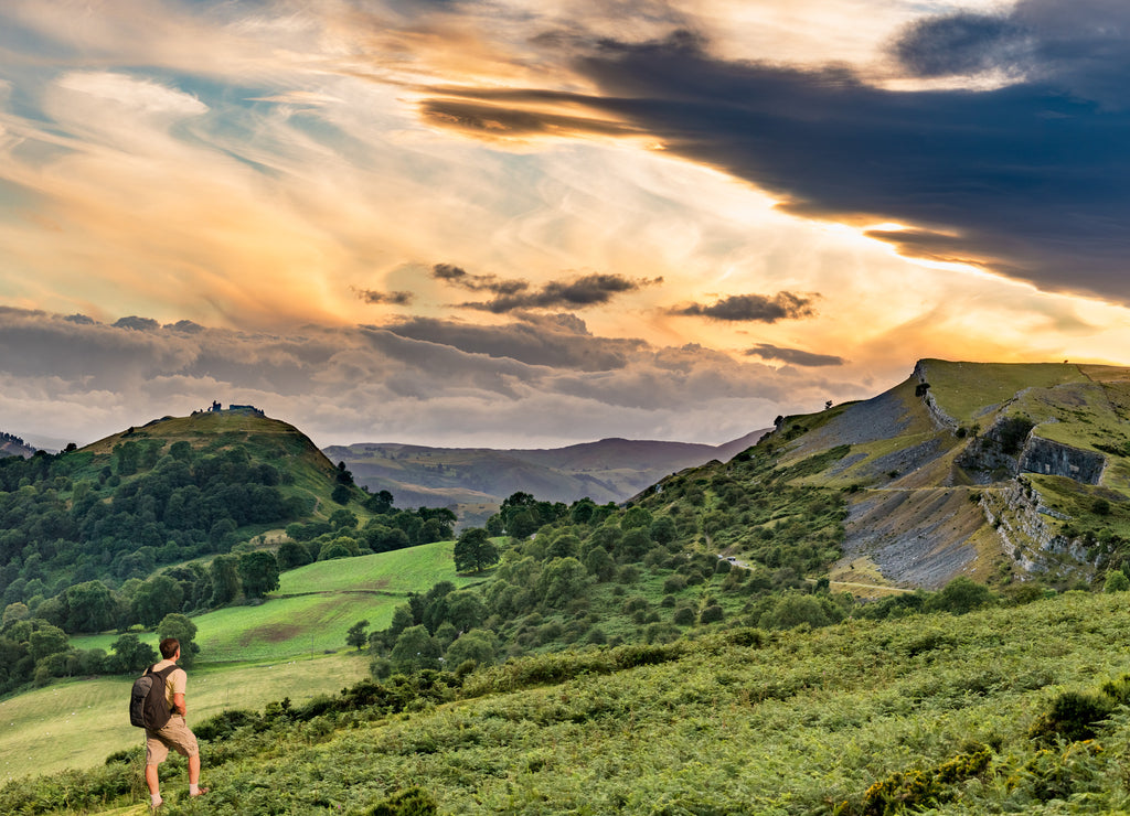 Hiker and sunset over Llangollen panorama