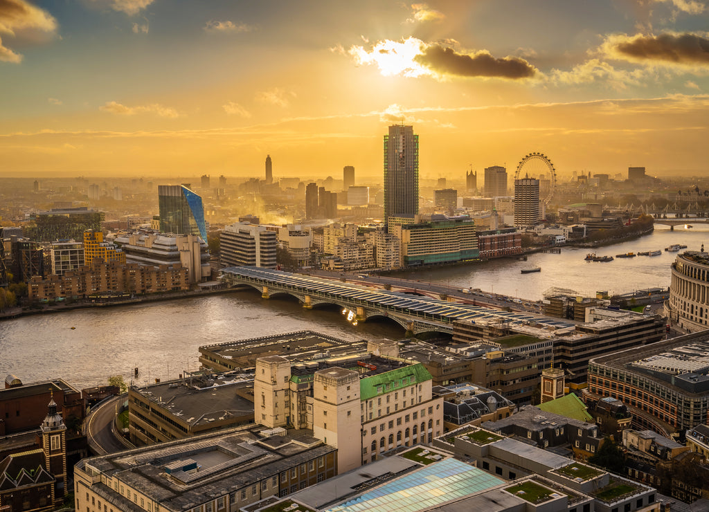 London, England - Panoramic aerial skyline view of London at sunset with Blackfriars bridge over River Thames
