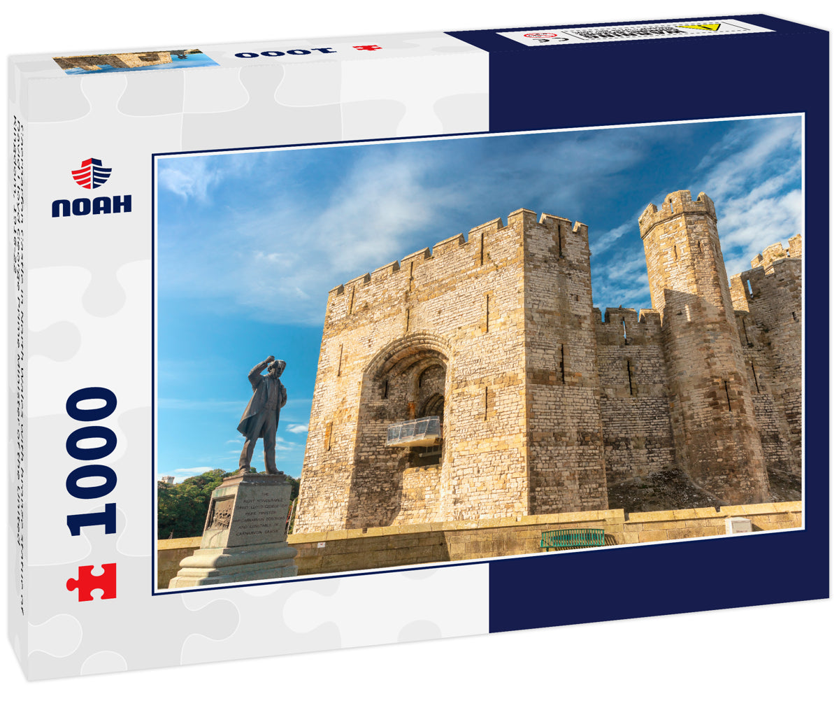 Caernarfon Castle in North Wales with bronze statue of David Lloyd George Prime Minister of the United Kingdom, 1916-22