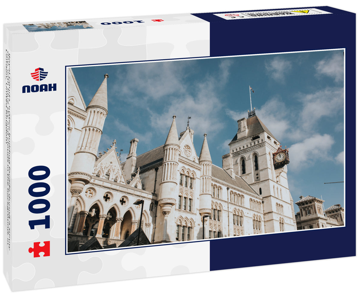 Royal Courts Justice building facade during a sunny day, with blue sky and clouds in the background, in London, United Kingdom