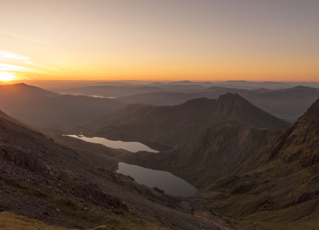 Sunrise through a Snowdonia mountain valley in Wales, UK