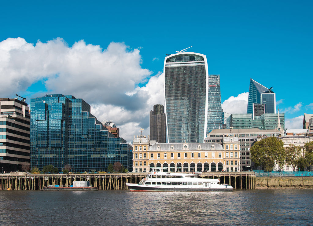 London District with Skyscrapers and a Boat in Thames River