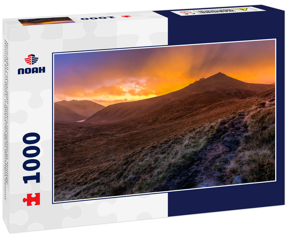 Beautiful valley with water reservoir in Mourne Mountains at golden hour and dramatic sunset. Mourne Mountains, highest range in Northern Ireland