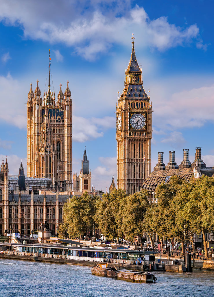 Big Ben and Houses of Parliament with boats on the river in London, England, UK