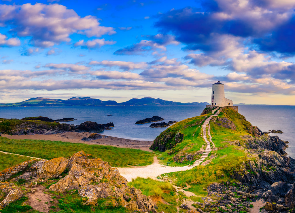 Sunset view of Lighthouse on Llanddwyn Island at the coast of Anglesey in North Wales