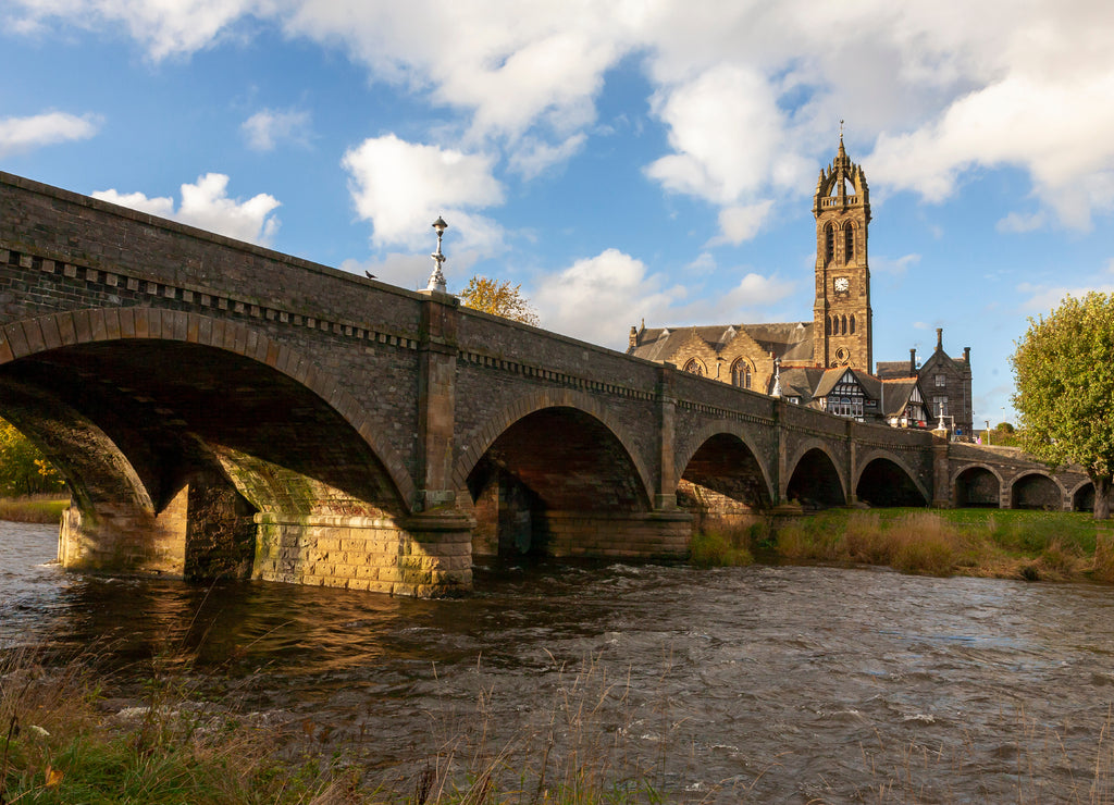 The river Tweed at Peebles, showing the Tweed Bridge and the Old Parish Church, Scottish Borders, UK