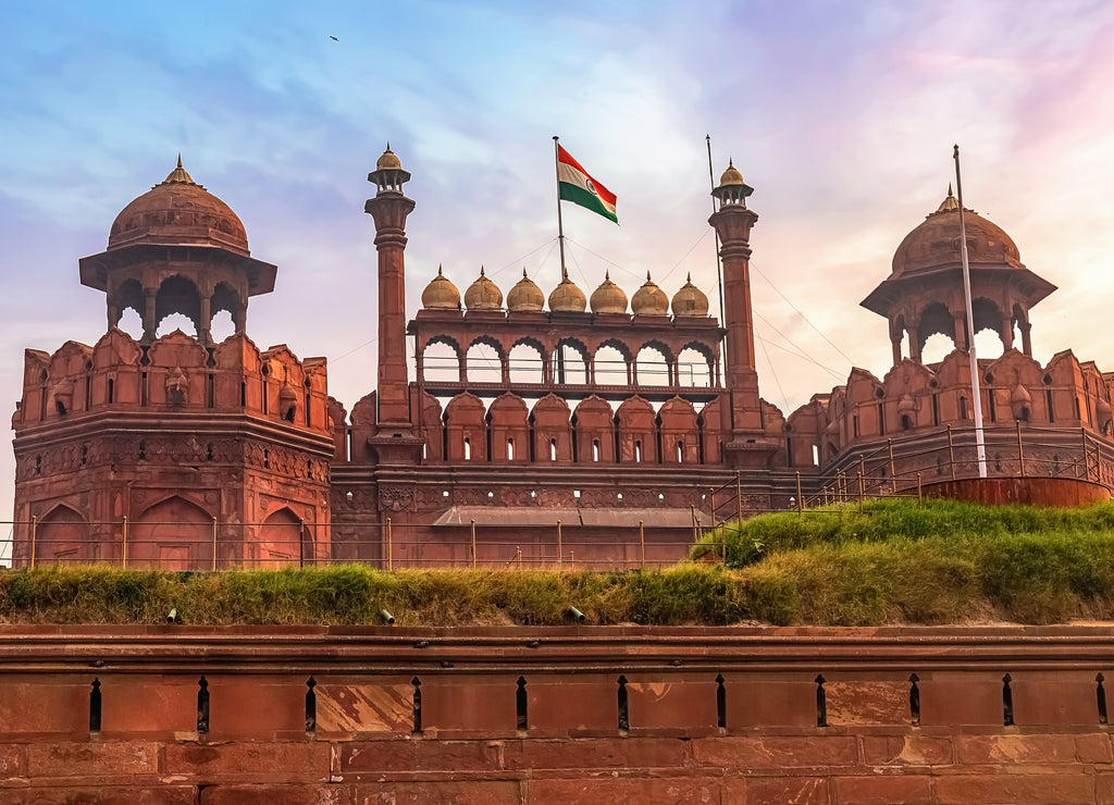 Historic Red Fort Delhi at sunrise. Red Fort is a medieval Indian architecture masterpiece designated as the UNESCO World Heritage site