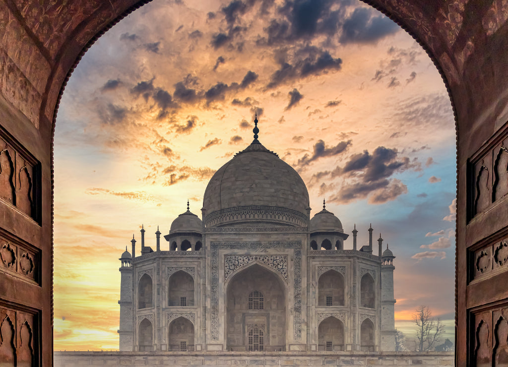 Taj Mahal is an ivory white marble mausoleum on Yamuna river in the Indian city