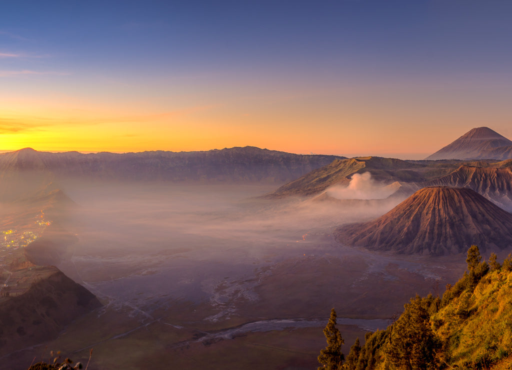 Panoramic view of Bromo active volcano mountain in a beautiful morning sunrise, East Java island in Indonesia