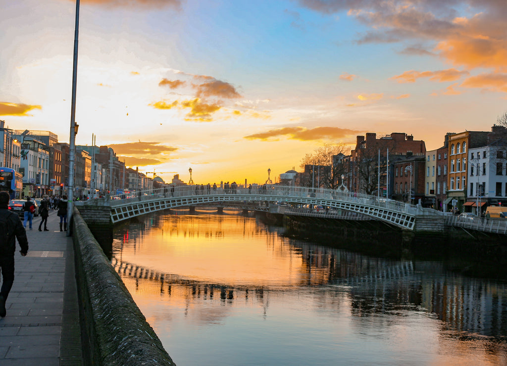 Dublin night scene with Ha'penny bridge and Liffey river lights