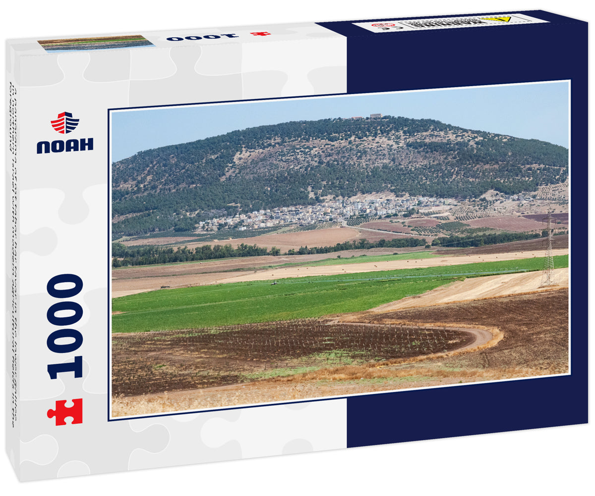 a panorama of mt tabor har tavor in the lower galilee in northern israel with modern agricultural fields in the foreground