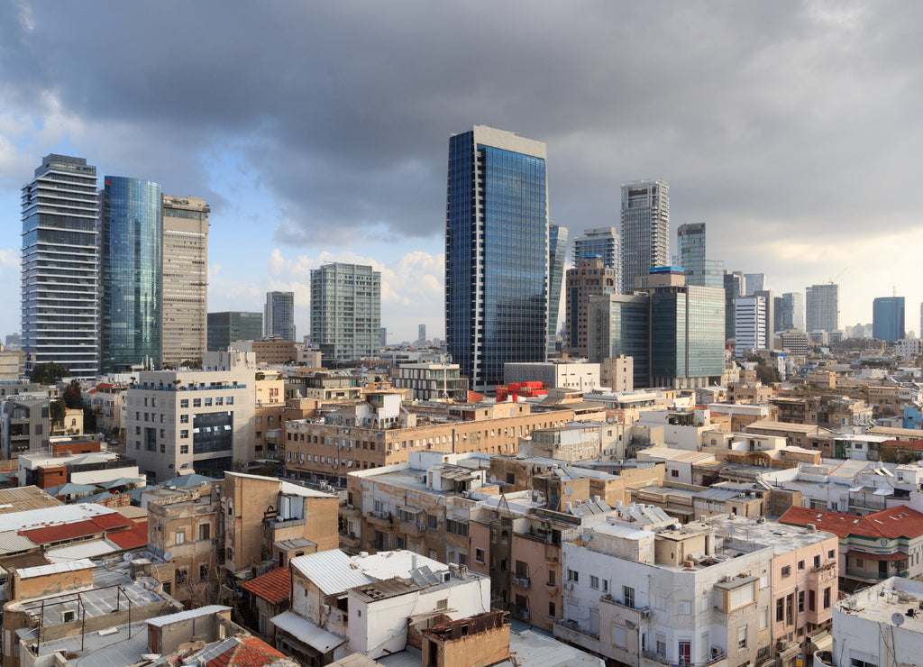 Skyline panorama of city Tel Aviv with some dark storm clouds and urban skyscrapers in the morning, Israel