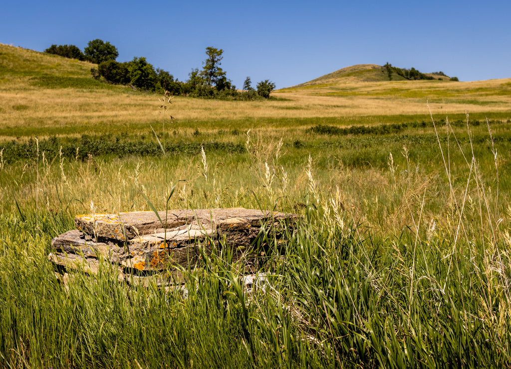 Old Foundation stones mark the spot of a building in the North Dakota hills at Fort Lincoln near Bismarck