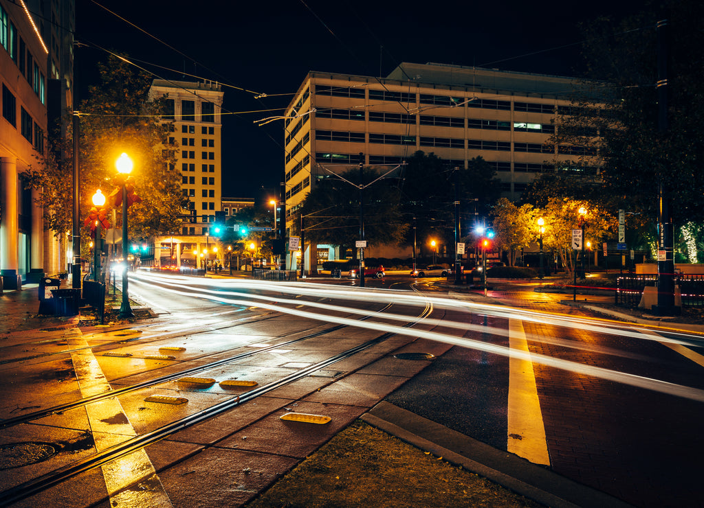 Tram tracks and buildings at night, in downtown Norfolk, Virginia