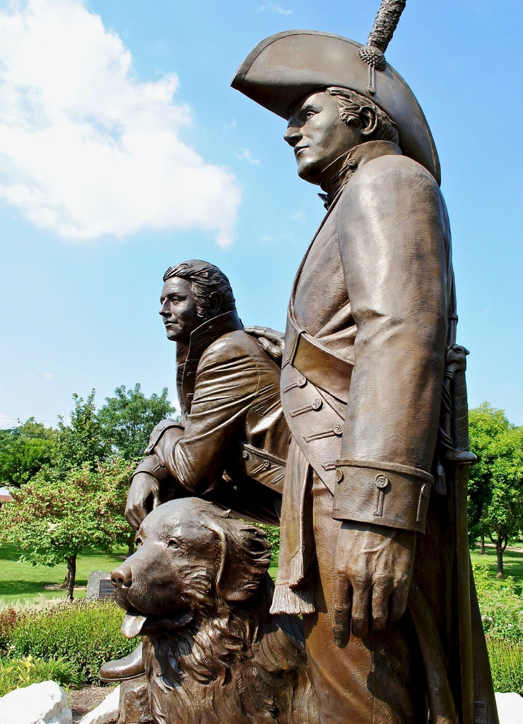 St. Charles, Missouri, USA: Lewis and Clark statue in Frontier Park near Missouri River. A bronze monument features Meriwether Lewis and William Clark and Clark's Newfoundland dog, Seaman