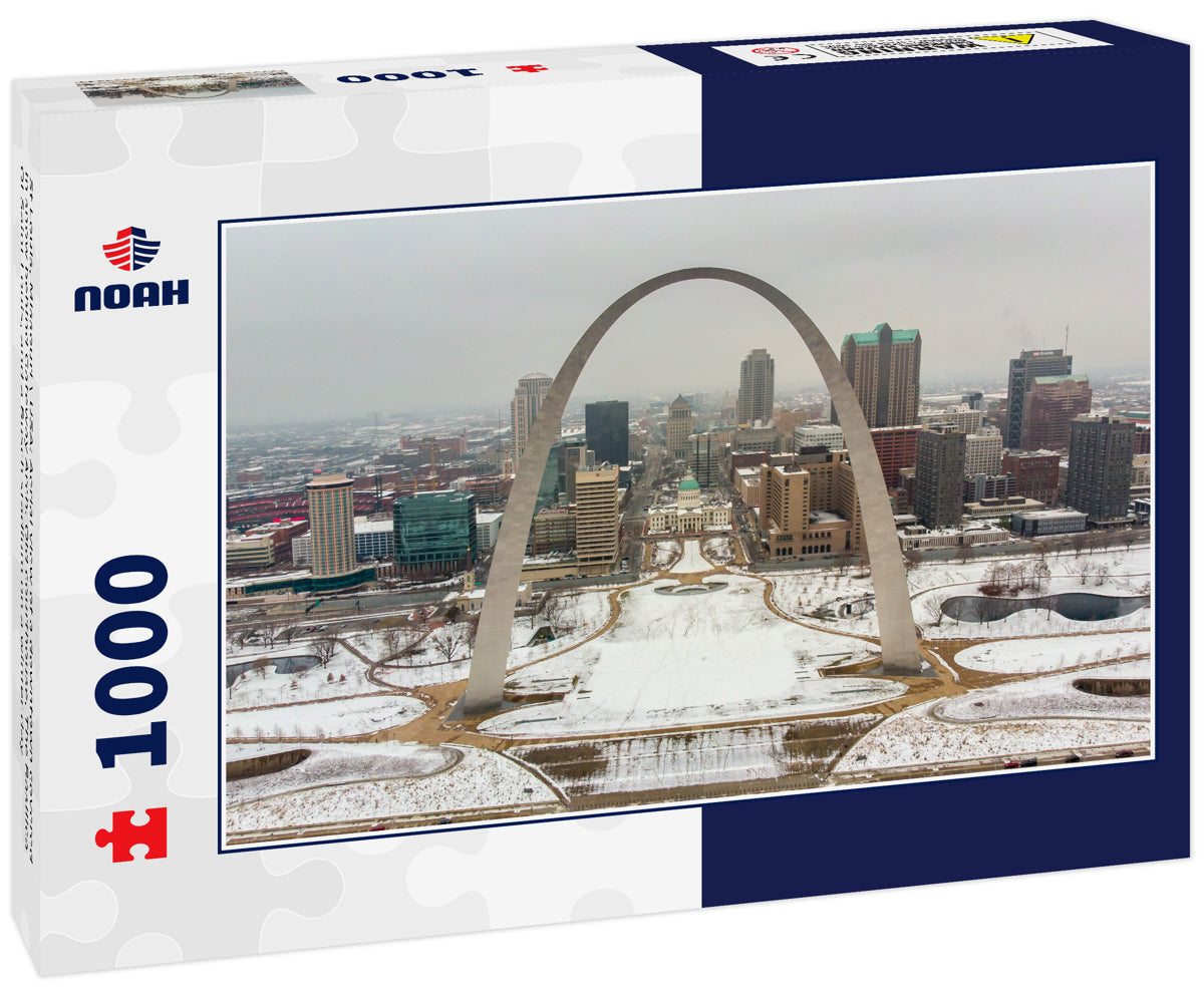 St Louis, Missouri \ USA: Aerial view of a downtown covered in snow behind Gateway Arch. Old courthouse, The Basilica Of Saint Louis, and a Busch stadium on a winter day