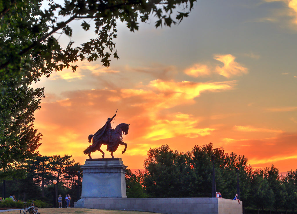 The sunset over the Apotheosis of St. Louis statue of King Louis IX of France, namesake of St. Louis, Missouri in Forest Park, St. Louis, Missouri