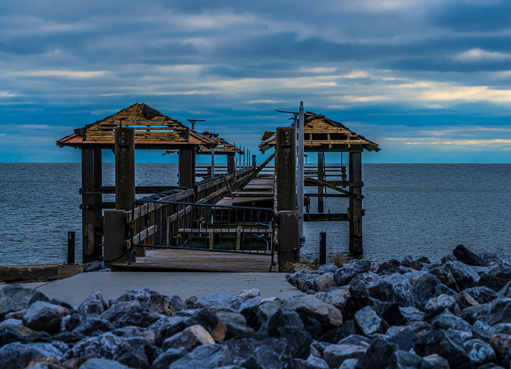 Pass Christian Mississippi seaside picnic area damaged in Hurricane with emphatic clouds