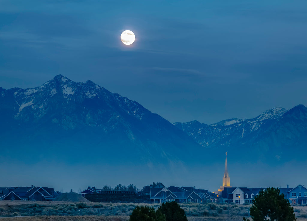 Daybreak Utah at night with bright moon in the sky