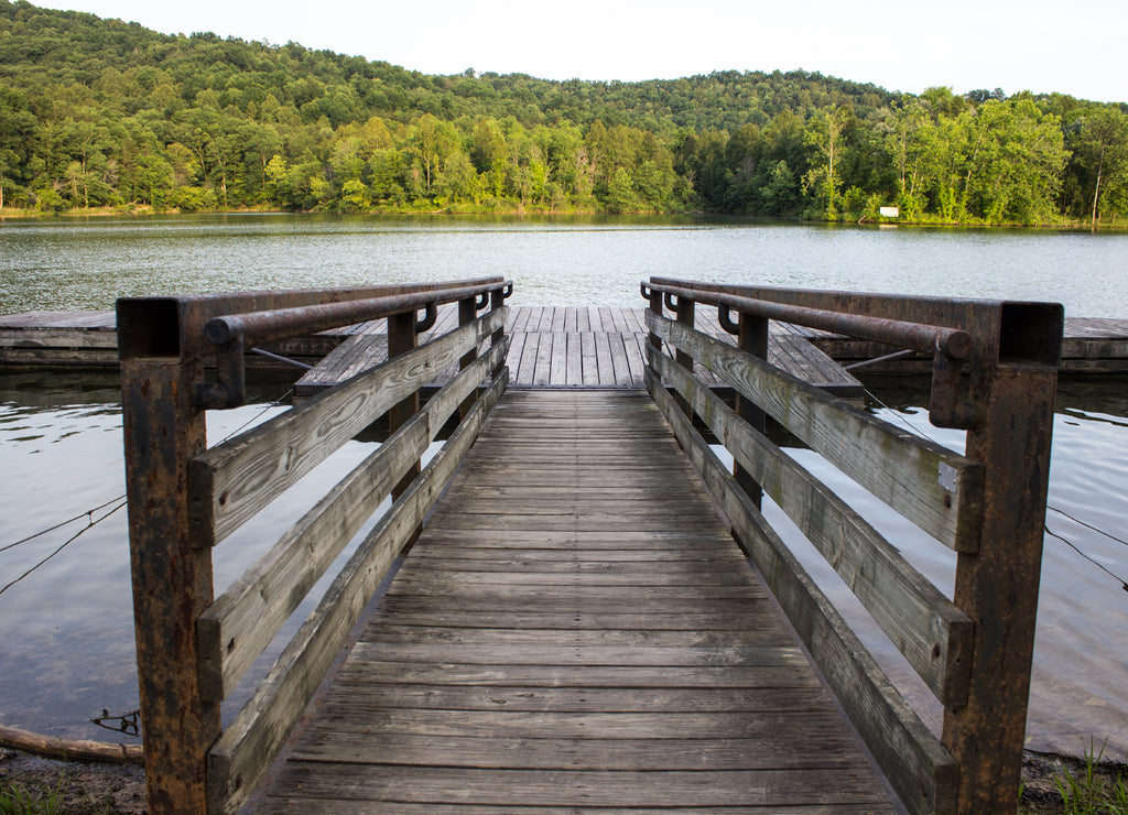 Summer At The Lake. Lake. Wooden dock extends into a lake with the Appalachian Mountains in the background at Grayson State Park, Grayson, Kentucky