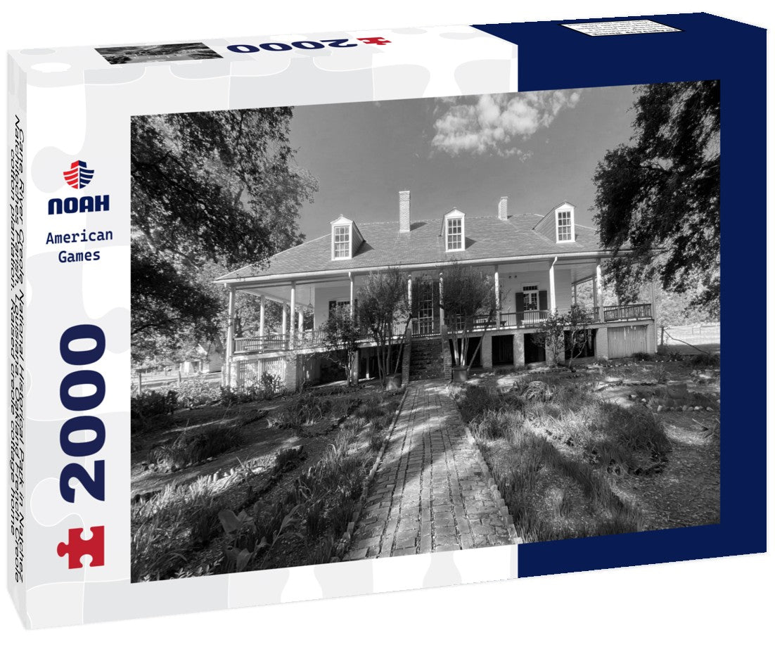 Noah Jigsaw Puzzle Cane River Creole National Historical Park in Natchez, Natchitoches Parish, Louisiana. Oakland French Creole cotton plantation. Raised creole cottage home, wrap around porch, bottle garden in black white 2000 pieces