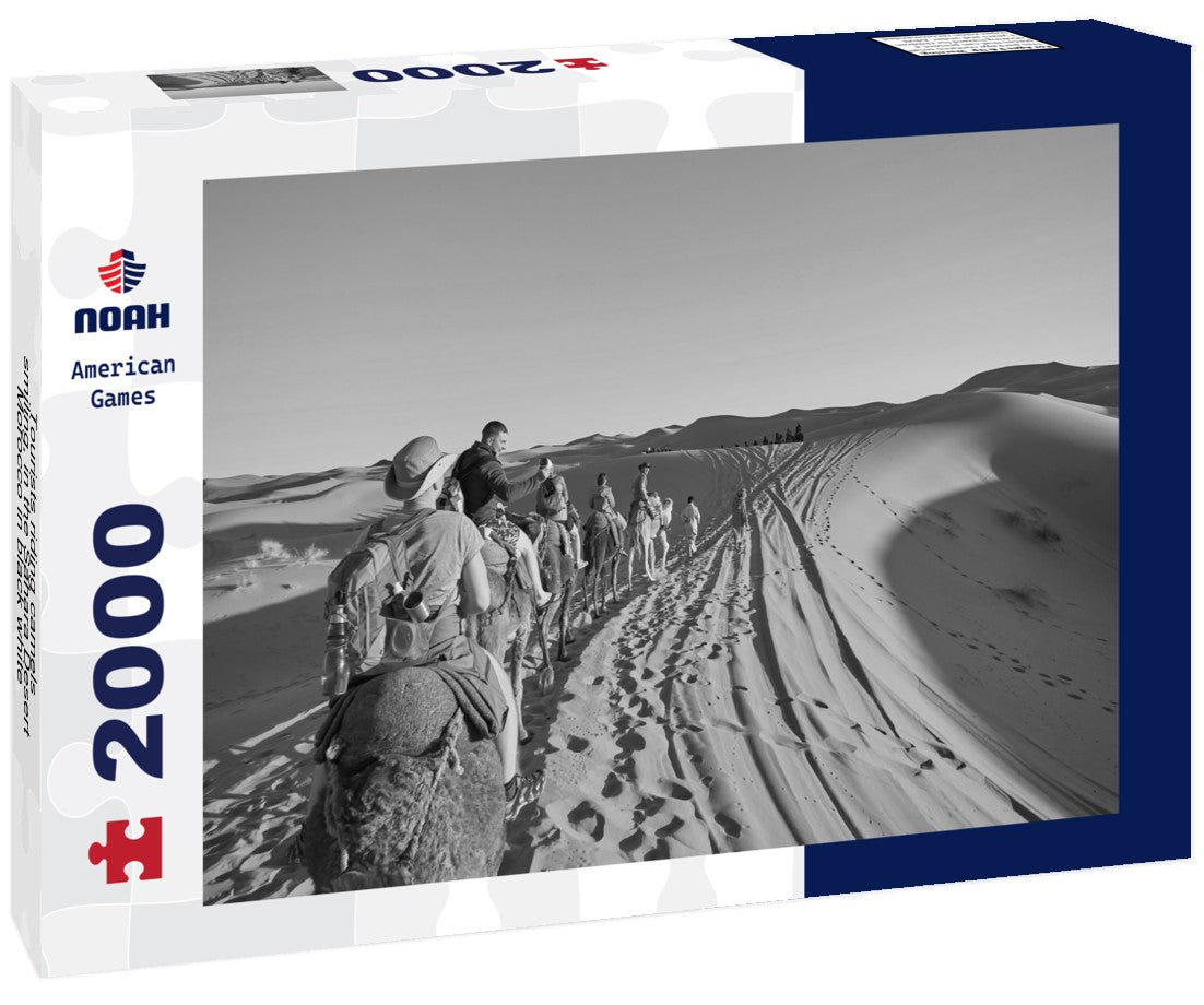 Noah Jigsaw Puzzle Tourists riding camels, smiling, in the Sahara Desert, Morocco in black white 2000 pieces