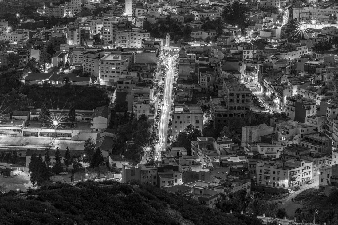 The vibrant town of Chefchaouen, nestled in the Rif Mountains of Morocco, comes alive at night with a dazzling display of lights. The iconic blue-washed buildings create a magical and picturesque view 2000pc PuzzleBlack and White
