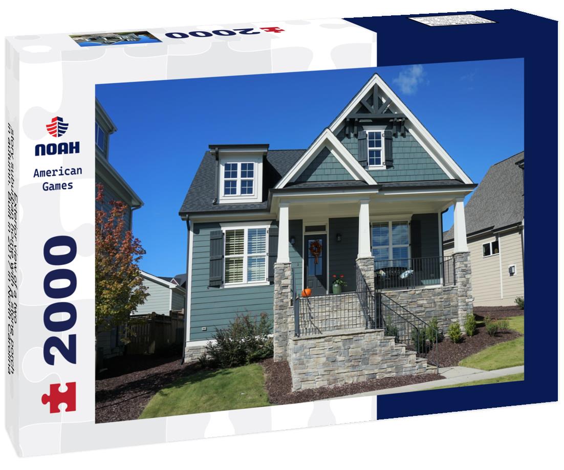 Noah Jigsaw Puzzle Exterior view of a two-story suburban home with a stone porch in autumn. Built in 2017 in North Carolina 2000 pieces