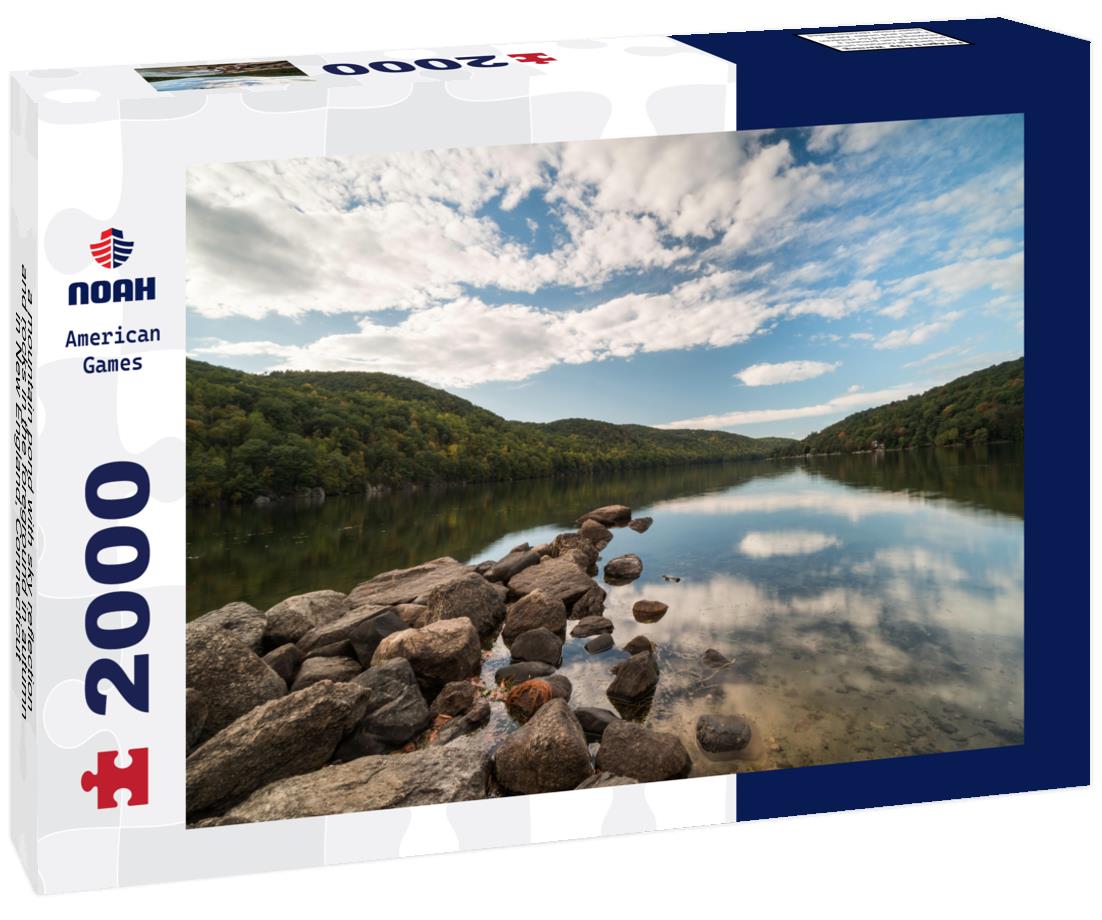 Noah Jigsaw Puzzle a mountain pond with sky reflection and rocks in the foreground in autumn in New England, Connecticut 2000 pieces