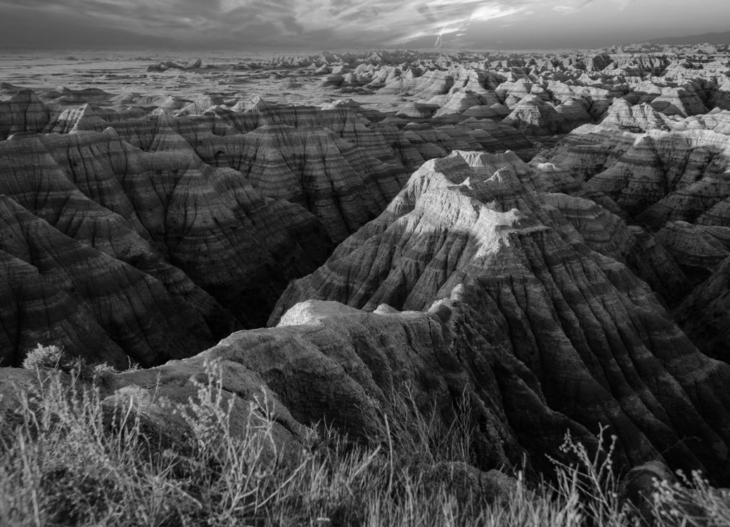 Mesmerizing view of Badlands National Park in South Dakota during a beautiful sunset in black white