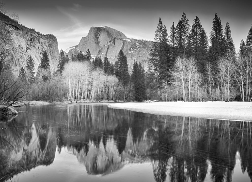 View of half dome reflected in the Merced river at Yosemite in black white