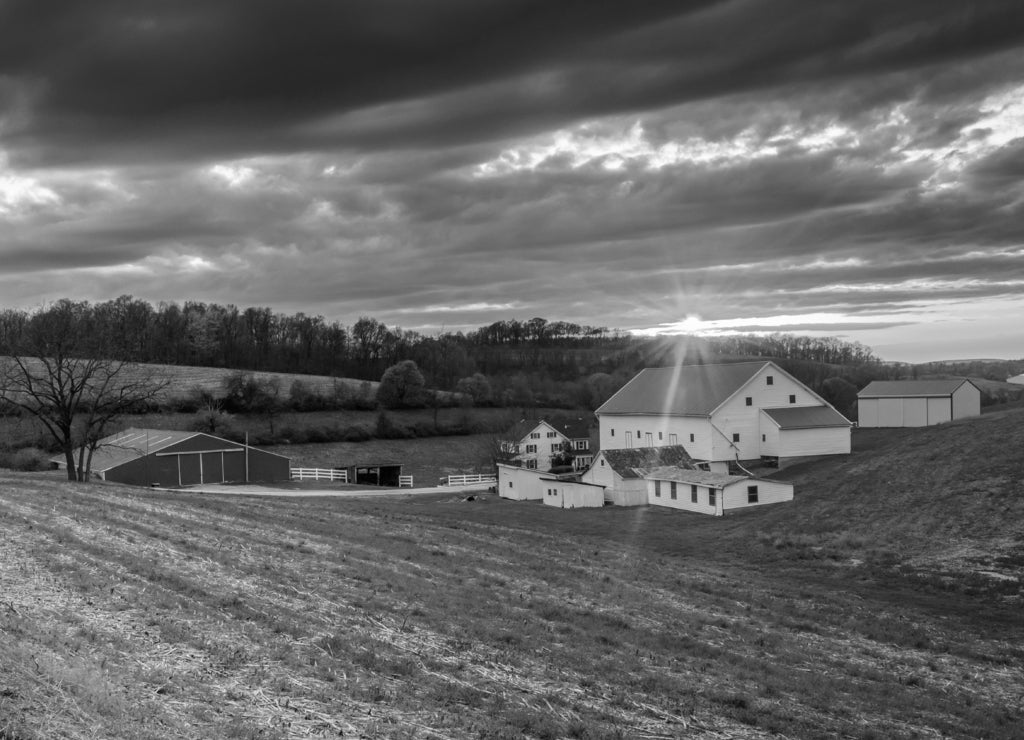 Sunset over a farm in rural York County, Pennsylvania in black white
