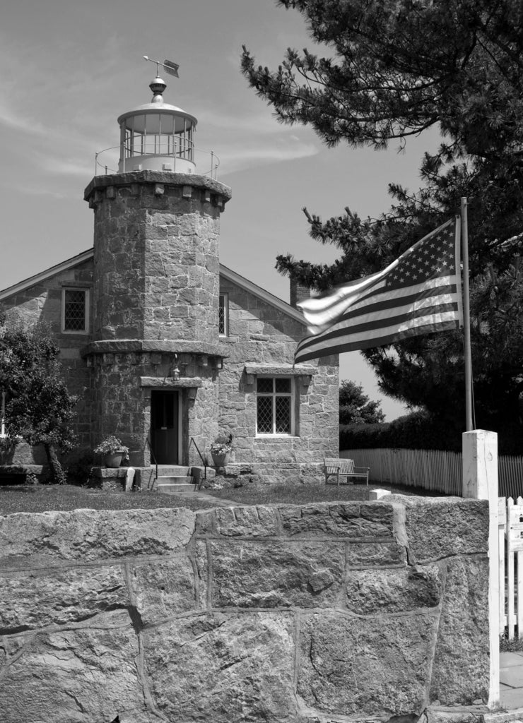 Stonington Harbor Lighthouse was built of stone and currently is used as the Stonington Library in Connecticut in black white