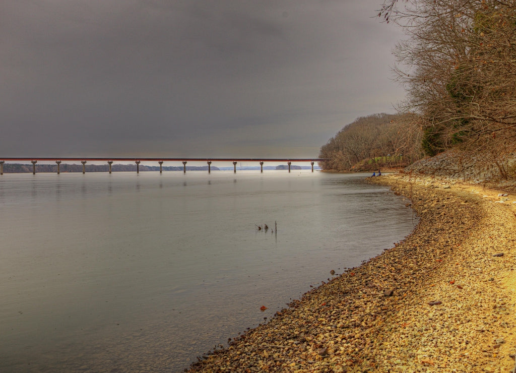 A View Of The John Coffee Memorial Bridge From The Bank Colbert Ferry Colbert County Alabama Around Mile Marker 327.3 Natchez Trace Parkway Along the rocky bank of the Tennessee River