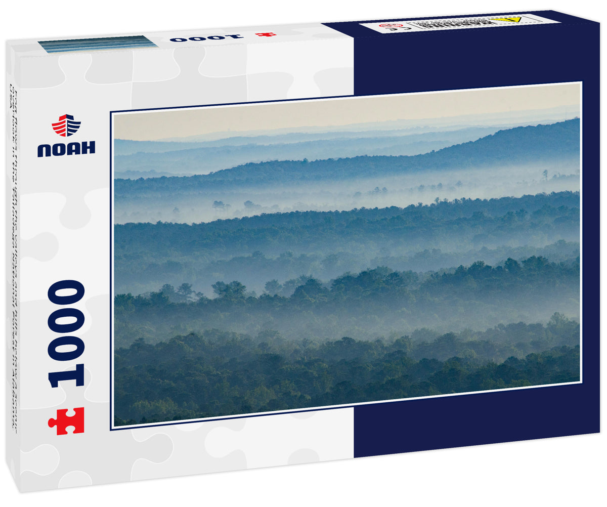 Fog flows through the valleys and hills below a scenic overlook in the Talladega National Forest in Alabama, USA