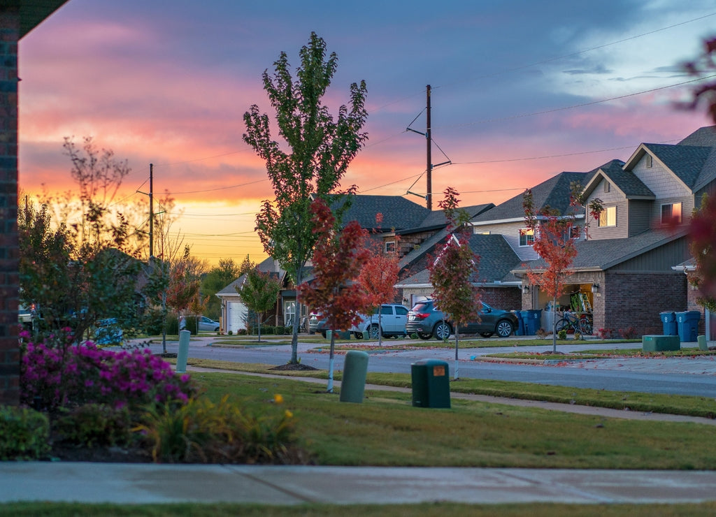 Living in Residential Housing Neighborhood Street at Sunset in Bentonville Arkansas