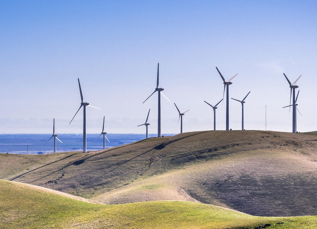 Wind turbines on the hills of east San Francisco bay, Stockton valley in the background, Alameda county, California
