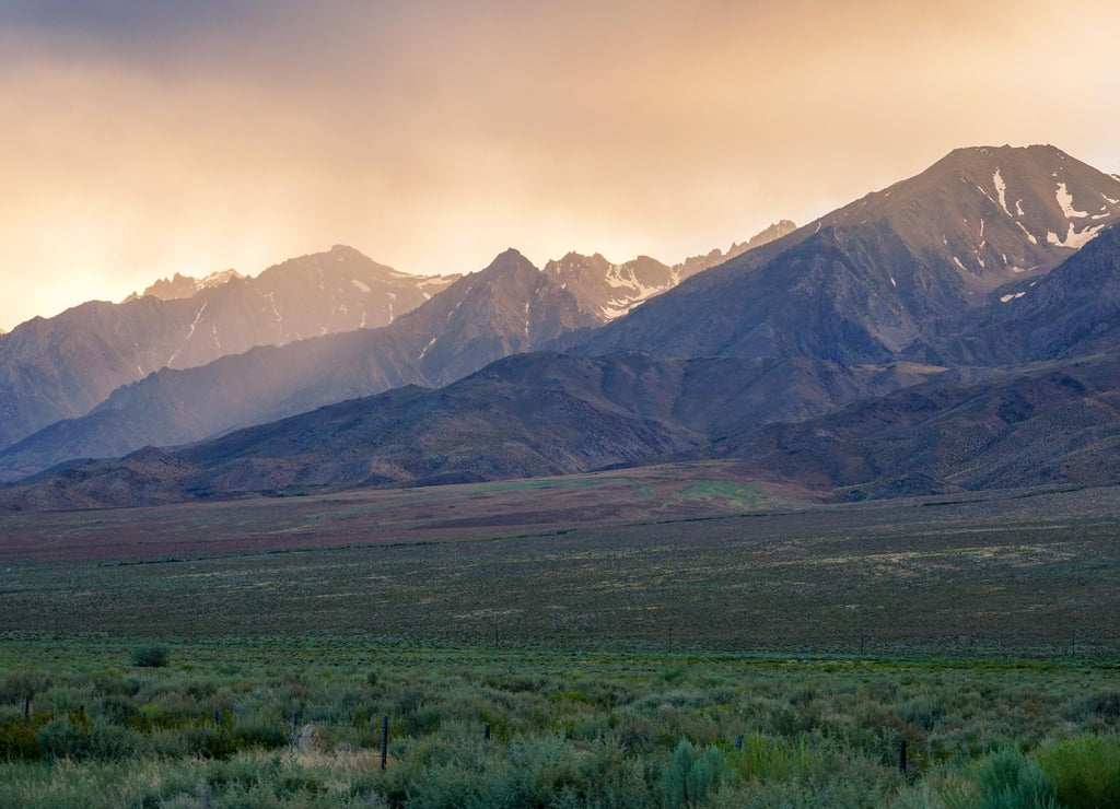 Mountain range colorful sunset with clouds before storm , Eastern Sierra Mountains, Mono County, California, USA