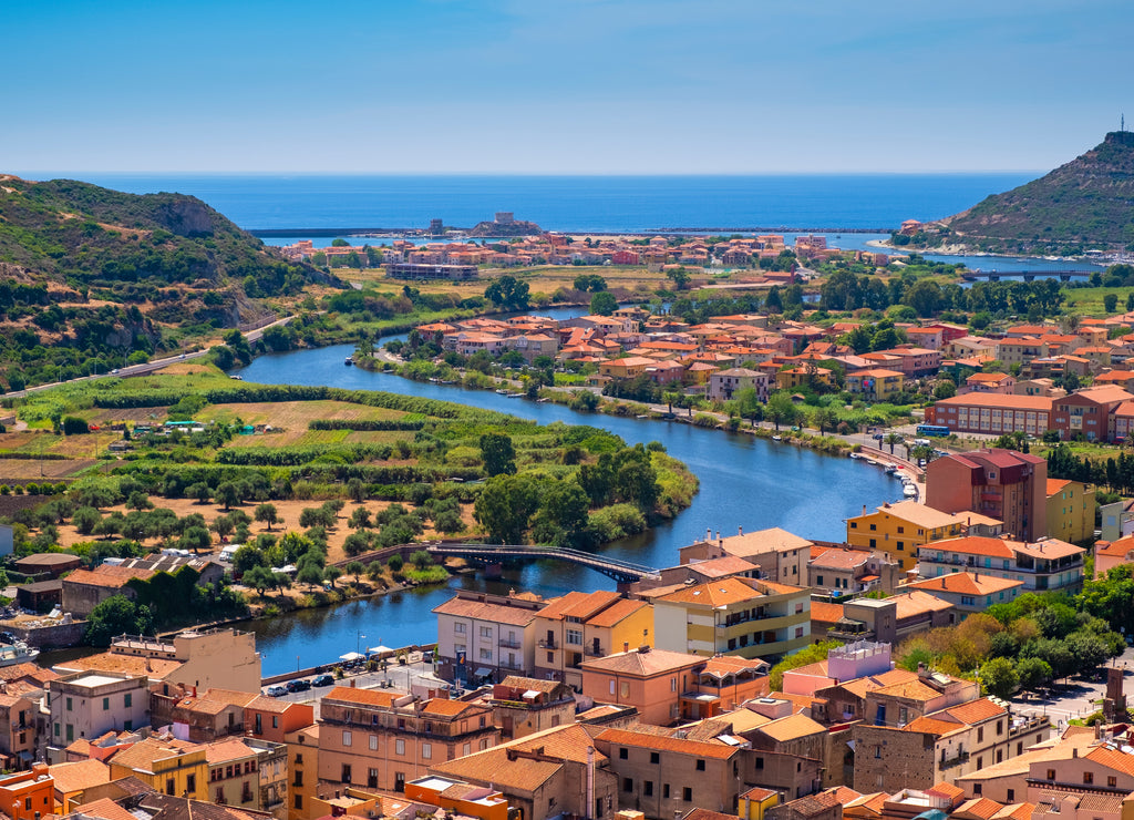 Sardinia, Italy - Panoramic view of the town of Bosa by the Temo river with Bosa Marina resort at the Mediterranean sea coast seen from Malaspina Castle hill