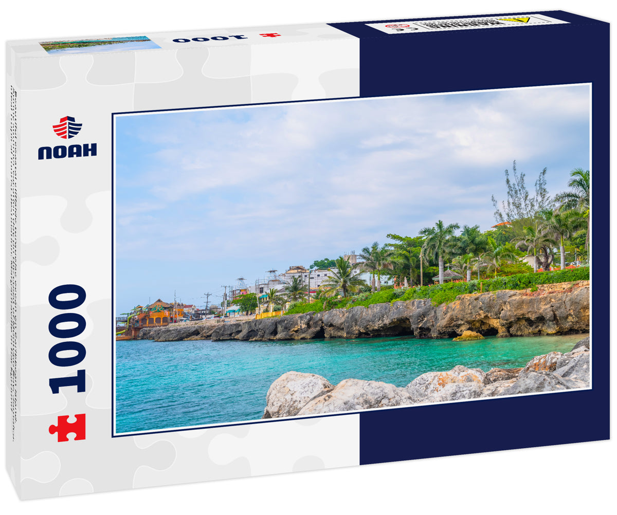 Beautiful coastal cliffside turquoise ocean on Caribbean island. Sunny summer vacation day on the coast of Montego Bay, Jamaica. Ideal tropical tourist destination. Margaritaville in background