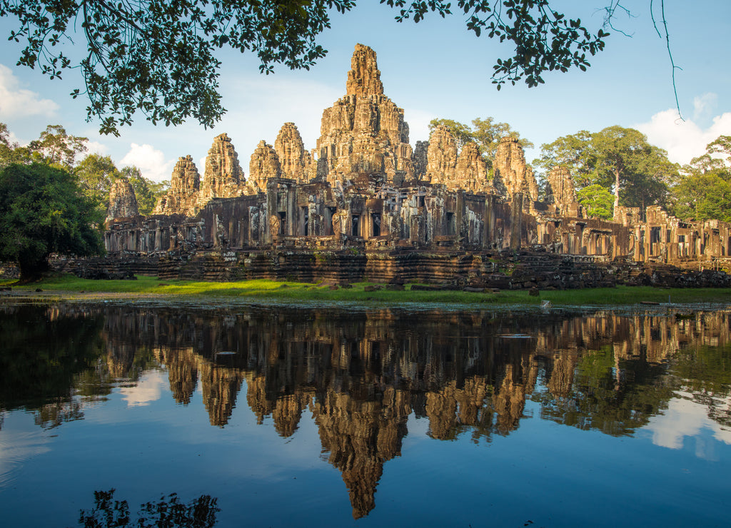 The spectacular reflection of Bayon a mountain temple built to represent Mount Meru, the center of the universe in Hindu and Buddhist cosmology, Siem Reap of Cambodia