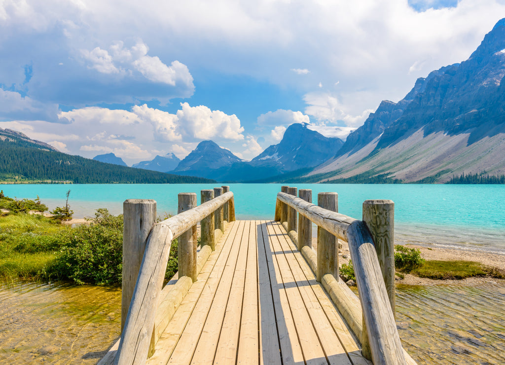 Majestic mountain lake and small wooden bridge in Canada