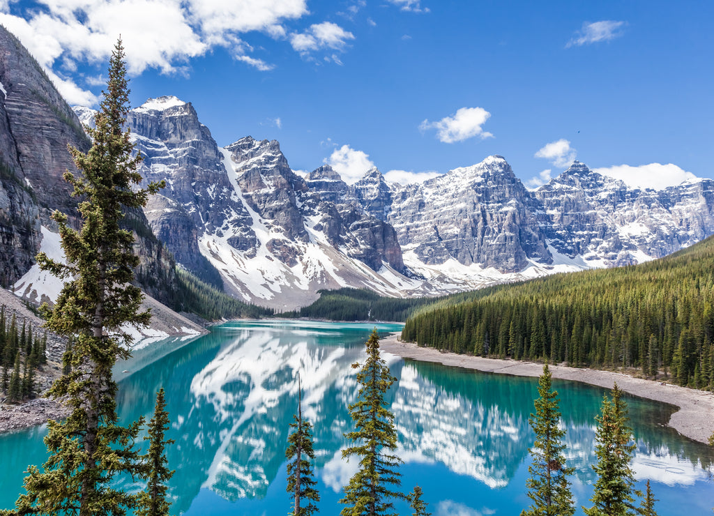 Moraine lake in Banff National Park, Canadian Rockies, Canada. Sunny summer day with amazing blue sky