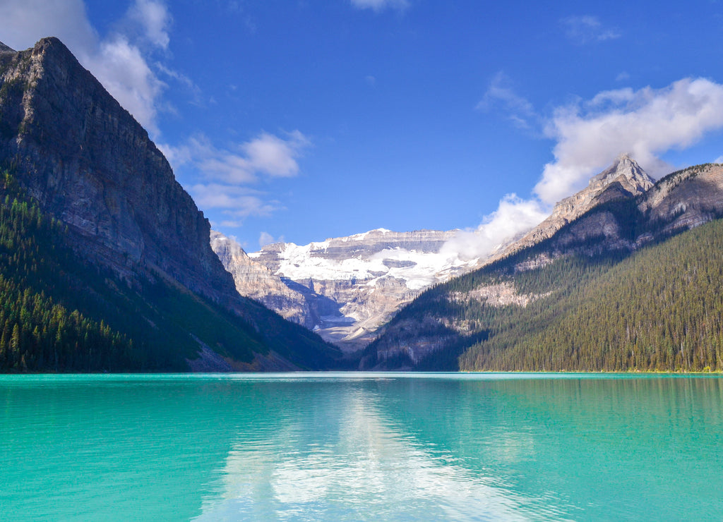 beautiful sunny day on Lake Louise, glacier fed light blue and turquoise waters, mountain peaks, glacier and no people. Iconic canadian rockies landscape. Wilderness, Banff national park