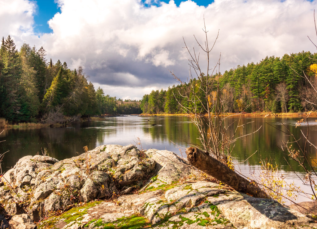 Looking upstream stream on the Madawaska River on a brilliant fall day in Eastern Ontario, Canada