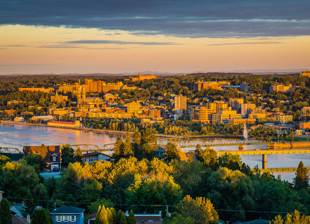 Colorful sunset and cloudy sky over the city of Chicoutimi in Quebec (Canada)
