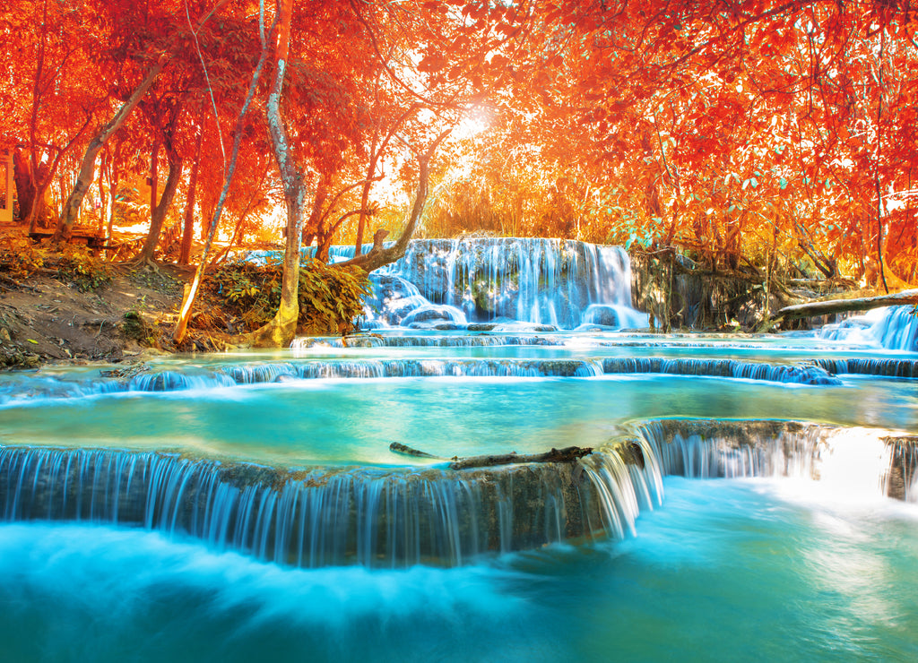 Waterfall in autumn forest, names " Tat Kuang Si Waterfalls " in Luang Prabang Lao with red leaves spring filter