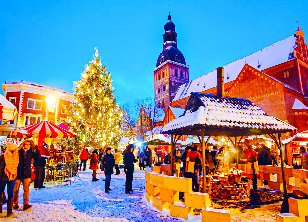 Night Cityscape with Christmas Market at Dome Cathedral square in Winter Riga, Latvia