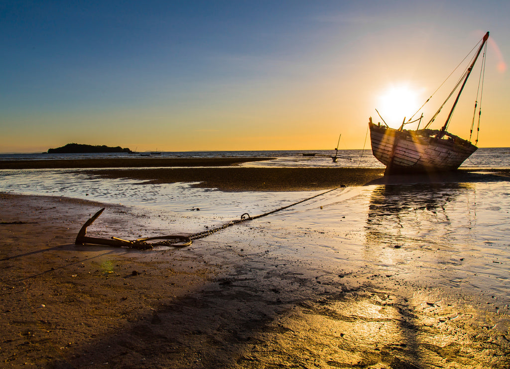 Stranded ship anchored on a sunset in Madagascar